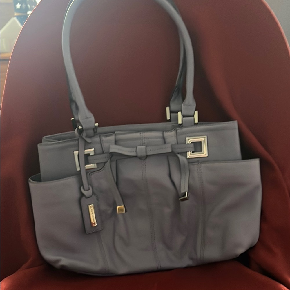 Nice  leather tignanello purse medium size light gray or a light lilac.